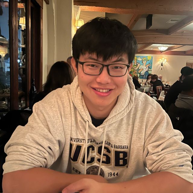 Han in a white sweater.